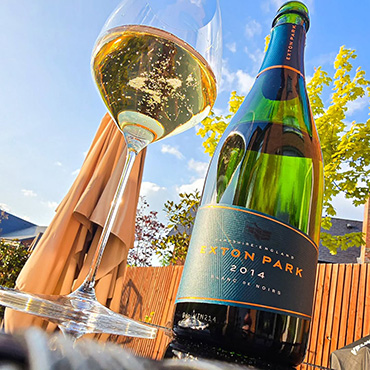 A bottle of Exton Park with a glass next to it