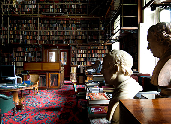 Athenaeum Club library with marble heads and walls of books